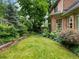 Lush backyard featuring a green lawn, mature plantings, and a serene, private atmosphere at 350 Fountain Oaks Ln, Atlanta, GA 30342
