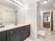 Bright bathroom showcasing gray vanity and tiled floors leading into the bedroom at 350 Fountain Oaks Ln, Atlanta, GA 30342