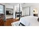 Elegant bedroom features a four-poster bed, fireplace, and built-in shelving for the television at 350 Fountain Oaks Ln, Atlanta, GA 30342