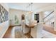 Well-lit dining room features pendant lighting, a wooden table with seating, and hardwood floors at 350 Fountain Oaks Ln, Atlanta, GA 30342