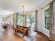 Bright dining room featuring hardwood floors, bench seating, many windows, and a modern light fixture at 350 Fountain Oaks Ln, Atlanta, GA 30342