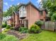 Beautiful brick home with manicured landscaping, featuring a charming bay window and a lush green lawn at 350 Fountain Oaks Ln, Atlanta, GA 30342