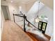 Stairway with a black and white handrail, high ceilings, and a statement light fixture at 350 Fountain Oaks Ln, Atlanta, GA 30342