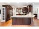 Modern kitchen with stainless steel appliances, granite countertops, and dark wood cabinetry at 350 Fountain Oaks Ln, Atlanta, GA 30342