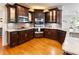 Well-equipped kitchen with stainless steel appliances and stylish dark wood cabinets at 350 Fountain Oaks Ln, Atlanta, GA 30342