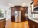 Kitchen with stainless steel refrigerator and dark cabinetry at 350 Fountain Oaks Ln, Atlanta, GA 30342