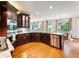 Spacious kitchen featuring modern appliances, granite counters, dark cabinets, and an open layout at 350 Fountain Oaks Ln, Atlanta, GA 30342