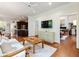 Living room with hardwood floors that looks toward the kitchen and the front living room at 350 Fountain Oaks Ln, Atlanta, GA 30342