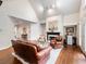 Living room featuring a fireplace, hardwood floors, a vaulted ceiling, and neutral paint at 350 Fountain Oaks Ln, Atlanta, GA 30342