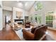 A living room with a fireplace, hardwood floors, lots of natural light and access to a deck at 350 Fountain Oaks Ln, Atlanta, GA 30342