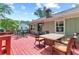 Back deck complete with table and chairs overlooking the greenery at 621 Windgrove Se Dr, Marietta, GA 30067