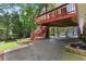 Backyard with a covered patio, trees, and a small grassy area at 621 Windgrove Se Dr, Marietta, GA 30067