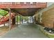 Backyard with a covered patio, trees, and a small grassy area at 621 Windgrove Se Dr, Marietta, GA 30067