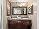 A full bathroom features a granite double vanity, framed mirror, and neutral wall color at 621 Windgrove Se Dr, Marietta, GA 30067