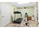 Bright exercise room equipped with a treadmill, elliptical, and tiled flooring at 621 Windgrove Se Dr, Marietta, GA 30067