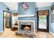 Inviting fireplace with stone surround and a decorative mantel, perfect for cozy evenings at 621 Windgrove Se Dr, Marietta, GA 30067