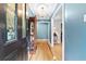 Grand foyer with hardwood floors, chandelier, and an elegant display case at 621 Windgrove Se Dr, Marietta, GA 30067