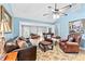 Spacious living room with leather seating, fireplace, and hardwood floors, perfect for entertaining at 621 Windgrove Se Dr, Marietta, GA 30067