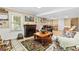 Relaxing living room with a fireplace, comfortable seating, and natural light at 621 Windgrove Se Dr, Marietta, GA 30067