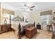 A spacious main bedroom features decorative windows and a wrought iron bed frame at 621 Windgrove Se Dr, Marietta, GA 30067
