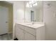 Bathroom with a single sink vanity, a large mirror, and updated flooring at 1102 Wynnes Ridge Se Cir, Marietta, GA 30067