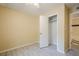 View of bedroom featuring a ceiling fan, wood-look flooring, and an open closet with an adjacent bathroom at 1102 Wynnes Ridge Se Cir, Marietta, GA 30067
