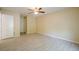 Bedroom with laminate flooring, a ceiling fan, and a doorway to the hallway at 1102 Wynnes Ridge Se Cir, Marietta, GA 30067