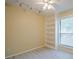 Bright bedroom features light walls, modern fan/light fixture, built-in shelves, and a window with bright natural light at 1102 Wynnes Ridge Se Cir, Marietta, GA 30067