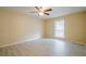 Spacious bedroom with new laminate flooring, ceiling fan, and a window bringing in natural light at 1102 Wynnes Ridge Se Cir, Marietta, GA 30067