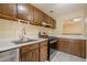 Efficient kitchen with wood cabinets and modern stainless steel appliances at 1102 Wynnes Ridge Se Cir, Marietta, GA 30067