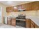 Charming kitchen featuring wood cabinets, stainless steel appliances, and bright countertops at 1102 Wynnes Ridge Se Cir, Marietta, GA 30067