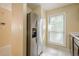 Kitchen featuring stainless steel refrigerator, and natural light streaming through the window at 1102 Wynnes Ridge Se Cir, Marietta, GA 30067