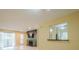 Open floor plan with a fireplace, TV, wood floors, and view to kitchen at 1102 Wynnes Ridge Se Cir, Marietta, GA 30067