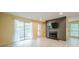 Bright open-concept living room with fireplace, TV, and sliding glass doors to outdoor balcony at 1102 Wynnes Ridge Se Cir, Marietta, GA 30067