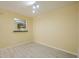 Versatile room featuring wood floors, neutral paint, and a pass through to the kitchen at 1102 Wynnes Ridge Se Cir, Marietta, GA 30067