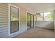 The screened porch has neutral carpet, a window, and a sliding glass door to the interior at 1102 Wynnes Ridge Se Cir, Marietta, GA 30067