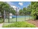 Community tennis courts provide an excellent opportunity for recreation and exercise amidst lush greenery at 1102 Wynnes Ridge Se Cir, Marietta, GA 30067