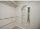 Spacious walk-in closet with ample shelving and arched doorway offers an organized storage solution at 1102 Wynnes Ridge Se Cir, Marietta, GA 30067