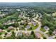 Expansive aerial view of the property, showcasing its proximity to natural woodlands at 3595 Millwater Xing, Dacula, GA 30019