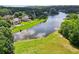 Beautiful lakefront homes with lush green lawns and mature trees offer a serene and private setting at 3595 Millwater Xing, Dacula, GA 30019