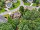 Aerial view of a well-maintained backyard, mature trees and neighboring homes at 3595 Millwater Xing, Dacula, GA 30019