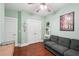 Charming bedroom featuring hardwood floors, a view of double closets, and a seating area with a couch at 3595 Millwater Xing, Dacula, GA 30019