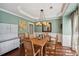 Charming dining area featuring neutral decor, a modern chandelier, and stylish furnishings at 3595 Millwater Xing, Dacula, GA 30019