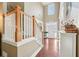Spacious foyer with hardwood floors, staircase, and natural light at 3595 Millwater Xing, Dacula, GA 30019