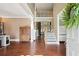 Spacious foyer with hardwood floors, staircase, and view to the upper level at 3595 Millwater Xing, Dacula, GA 30019