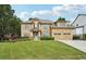 Charming two-story home featuring a manicured lawn, beautiful landscaping, and a welcoming front entrance at 3595 Millwater Xing, Dacula, GA 30019
