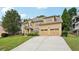 Charming two-story home featuring a manicured lawn, beautiful landscaping, and a welcoming front entrance at 3595 Millwater Xing, Dacula, GA 30019