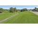 Scenic view of the well-maintained golf course with mature trees and landscaping at 3595 Millwater Xing, Dacula, GA 30019