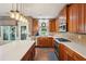 Well-lit kitchen featuring custom wood cabinetry, stainless appliances, and a spacious island with white countertop at 3595 Millwater Xing, Dacula, GA 30019