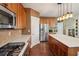 Kitchen featuring stainless steel appliances, light countertops, wood cabinets, and breakfast bar island seating at 3595 Millwater Xing, Dacula, GA 30019